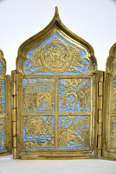 null QUADRIPTYCH TRAVEL ICON.
In gilded bronze, partially enamelled blue, decorated...