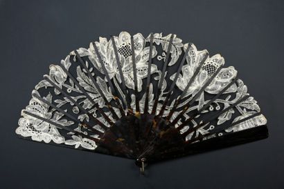 null Flowers in full bloom, circa 1900-1910
Folded fan, the black tulle leaf decorated...