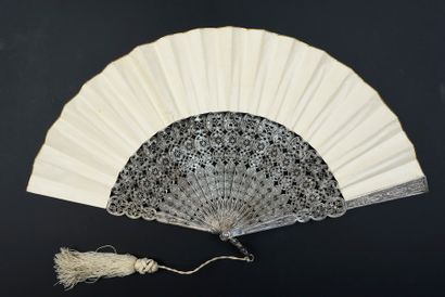  Silver filigree, circa 1880 Folded fan, the double leaf in skin painted in the 18th...