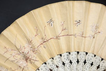 Embroidered flowers, China, 19th century Folded fan, the double leaf in cream silk...