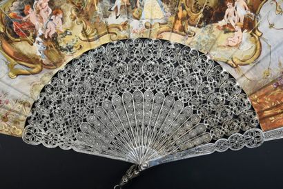 null Silver filigree, circa 1880
Folded fan, the double leaf in skin painted in the...