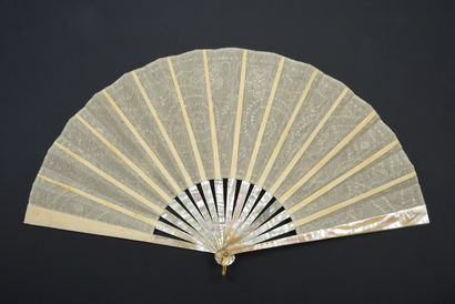 null Silver scrolls, circa 1900-1920
Folded fan, the leaf embroidered with silver...