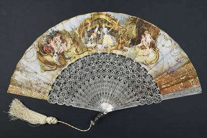null Silver filigree, circa 1880
Folded fan, the double leaf in skin painted in the...