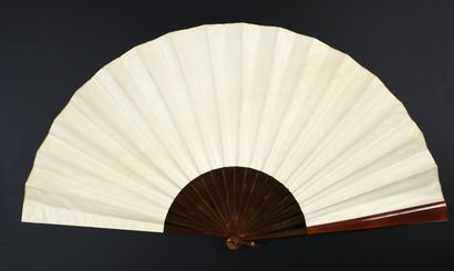null The dunce's cap, circa 1890-1900
Large fan, the double leaf in cream skin painted...