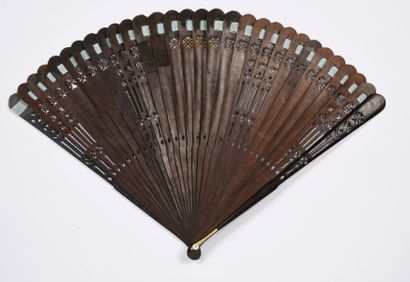null The Fan Wind, ca. 1790
A broken fan of brown wood, reperced and painted with...