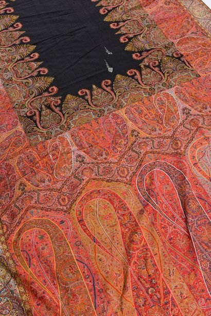 null Long cashmere shawl, India, circa 1840, black rectangular reserve encircled...