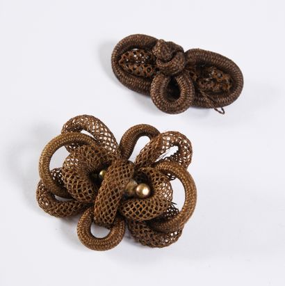 null Two brooches made of braided hair, 19th century, both decorated with knots in...