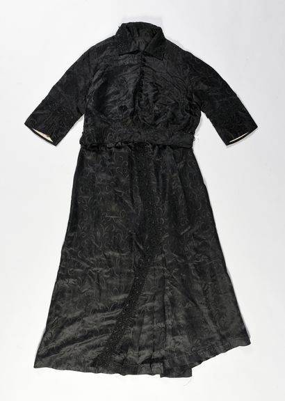 null Part of the wardrobe of an elegant, two daytime dresses, circa 1900, black damask...