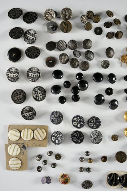 null A combination of metal and glass buttons, mainly from the 19th century, buttons...
