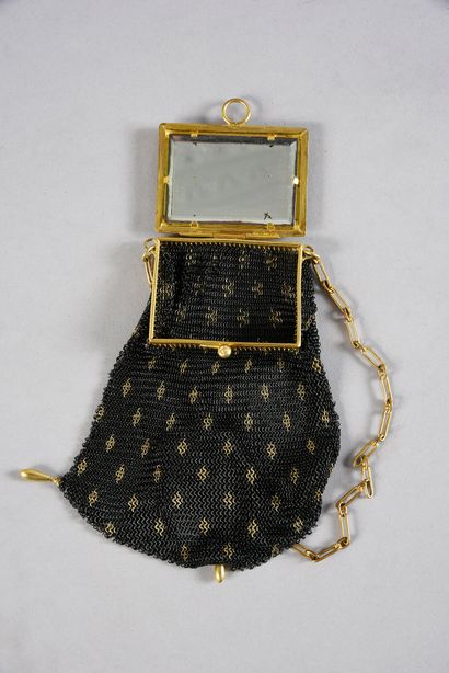 null Minaudière, circa 1910, the black and gold steel mesh pocket weighted with three...