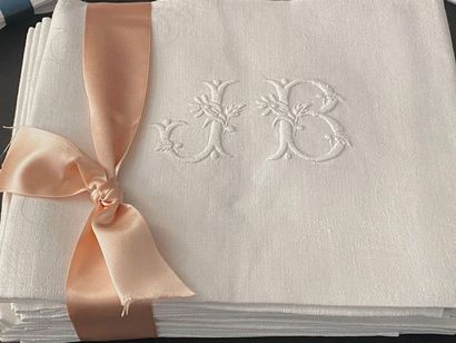 null In damask linen, a series of eleven large napkins with baskets of flowers and...