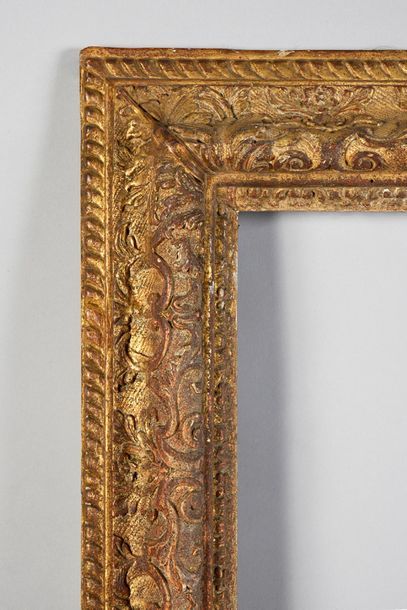 null Beautiful carved and gilded oak frame with an upside down profile and rich Bérain...