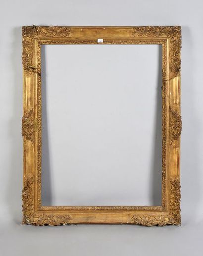 null Carved and gilded wooden frame with scroll decoration in the corners and middle.

Beginning...