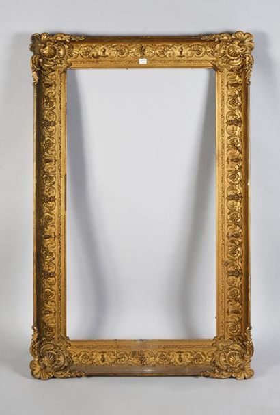 null Wooden frame and gilded paste with rocaille decoration of friezes of applied...