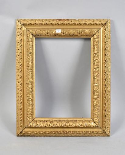 null Sculpted and gilded linden wood frame with an upside down profile and acanthus...