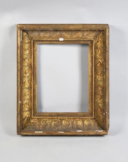 null Wood and gilded paste frame with a large decoration of acanthus leaves, bears...