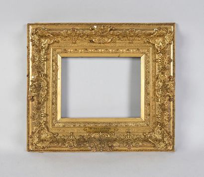 null Very beautiful wooden frame and gilded stucco with rich decoration of manbrequins,...