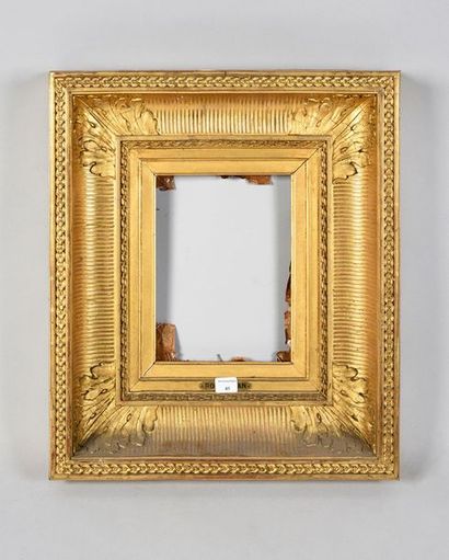 null Wooden frame and gilded stucco called "with channels" with decoration of piastres...