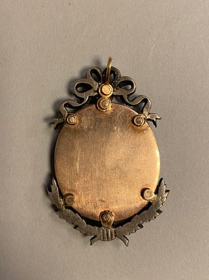 null MEDALLION PENDANT. 
 Containing a polychrome miniature on enamel of oval shape,...