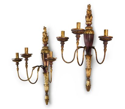 null A suite of four sculpted, red lacquered and gilded wood sconces with three arms...