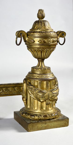 null Pair of chased and gilded bronze andirons with covered pot decoration on a half...
