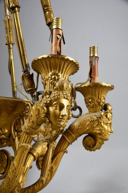 null Chiseled and gilded bronze chandelier with six arms of light with a motif of...