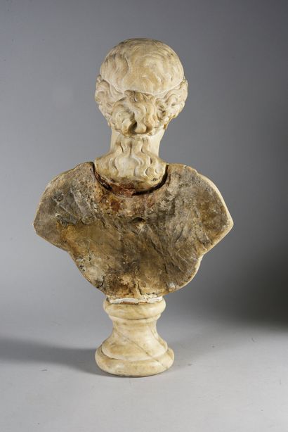 null Female bust in sculpted white marble, resting on a moulded pedestal, the draped...