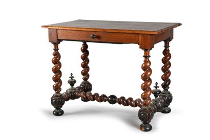 null Sitting room table in walnut and blackened wood, opening with a drawer in the...