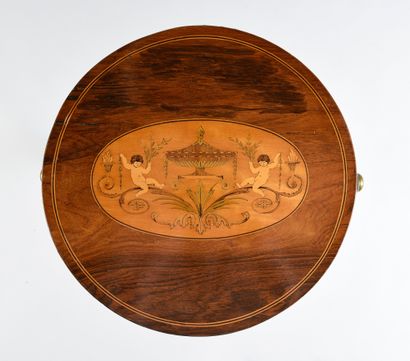 null Small circular work table with an opening top decorated with putti in veneer...