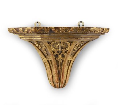 null Carved and gilded wood console with decoration of foliage scrolls and fleurons.
The...