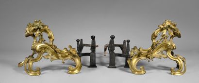 null Pair of chased and gilt bronze rocaille andirons.
Louis XV period.
With their...