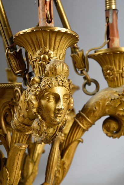 null Chiseled and gilded bronze chandelier with six arms of light with a motif of...