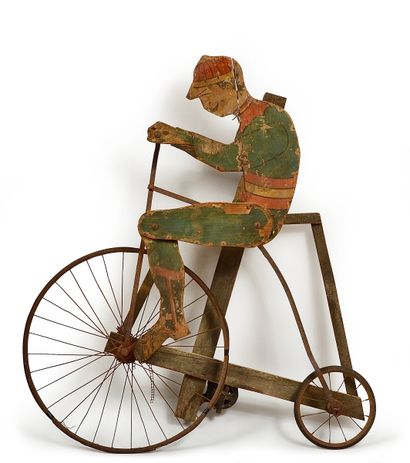 null Sign "Grand Bi". Circa 1900. Painted wood with a motor used to animate the rider....