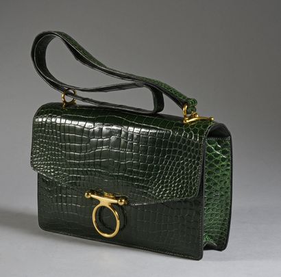 HERMES 
Sequana clutch bag, emerald green Niloticus crocodile, gold-plated trim.