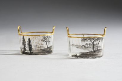 DAUM Nancy 
Two cut crystal saltcellars, enamelled decoration of landscapes in grisaille....