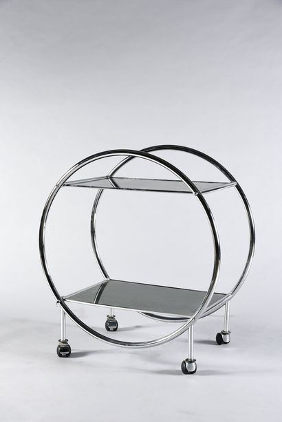 null Table on wheels with tubular structure and two glass tops.
Work in the modernist...