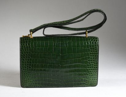 HERMES 
Sequana clutch bag, emerald green Niloticus crocodile, gold-plated trim.