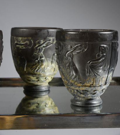 Georges de FEURE (1868 - 1943) 
A suite of four satin-finish pressed glass vases,...