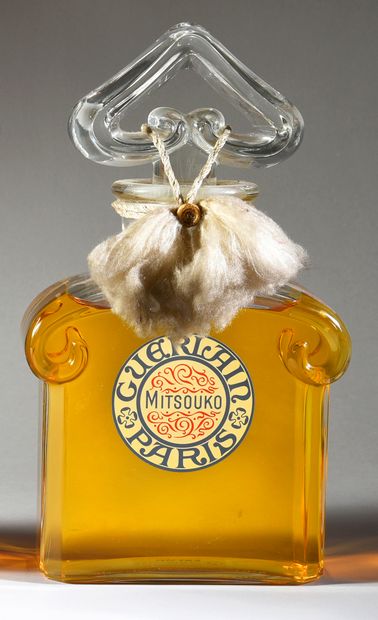GUERLAIN - «Mitsouko» - (1919) 
Pressed colorless glass bottle model "four volutes...