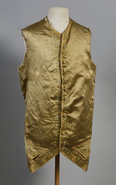 null . Waistcoat with basques, Louis XVI period, old gold silk satin embroidered...