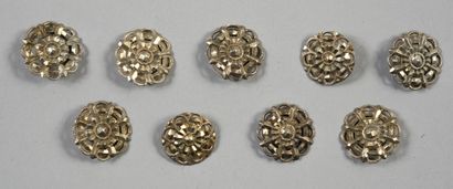 null . Two sets of silver suit buttons, first third of the 19th century, seven silver...