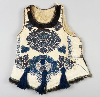 null . Embroidered breastplate, Hungary, early 20th century, cream sheepskin embroidered...