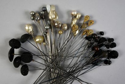 null . Set of hatpins, circa 1900, ends decorated with black faceted glass beads,...