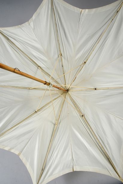 null 
. Meeting of five umbrellas and parasols, 1900- 1950 approximately, mainly...