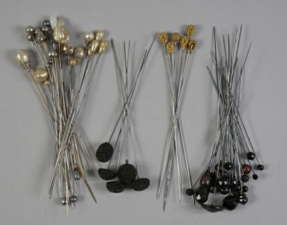 null . Set of hatpins, circa 1900, ends decorated with black faceted glass beads,...