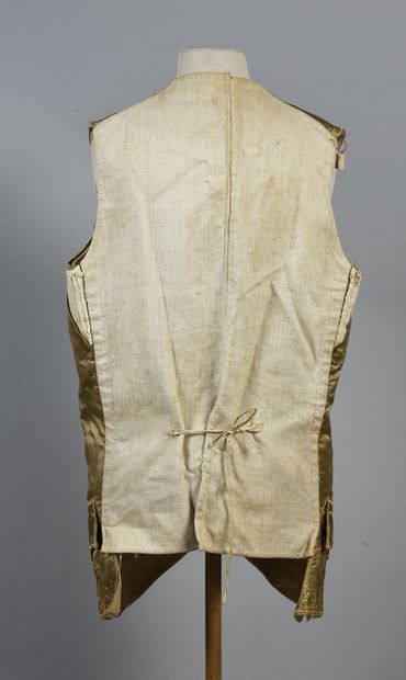 null . Waistcoat with basques, Louis XVI period, old gold silk satin embroidered...
