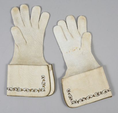 null . Pair of liturgical gloves with crispins, early 20th century, cream cotton...