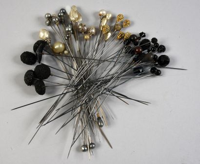 null . Set of hatpins, circa 1900, ends decorated with black faceted glass beads,...
