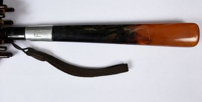 null 
. Parasol, circa 1930-1940, blackened wooden handle with tortoiseshell pommel,...