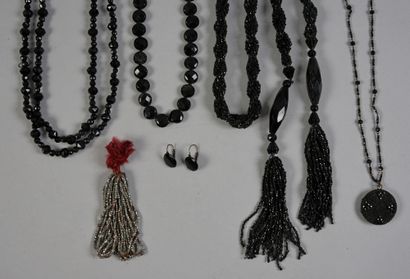 null . Set of four black glass bead necklaces and long necklaces, circa 1920, small...